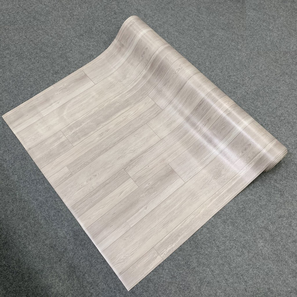 Thảm nhựa trải sàn vân gỗ - simili trải sàn vân gỗ chất liệu dày đẹp, dai và rất bền, có thể trải sàn nhà và lót mặt bàn tủ đều được.
